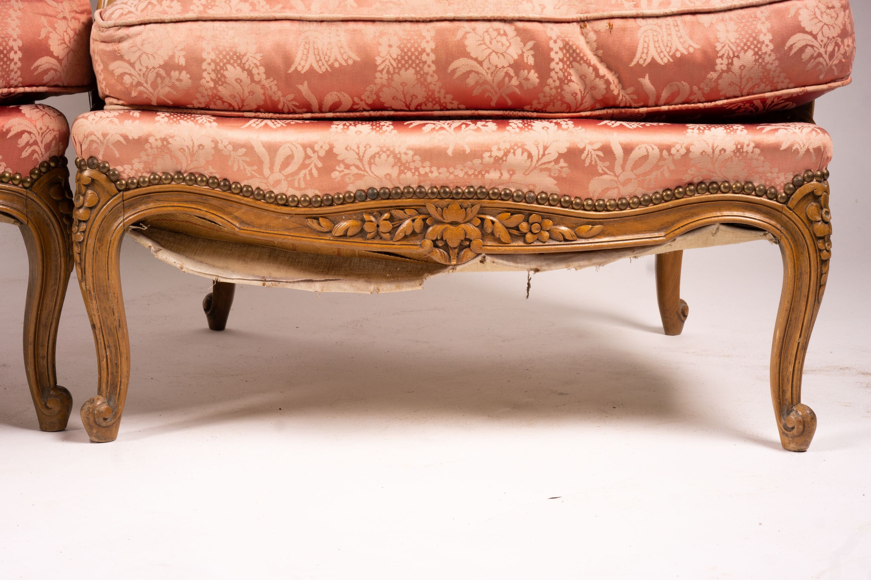 A pair of early 20th century French carved beech armchairs, width 75cm, depth 78cm, height 110cm